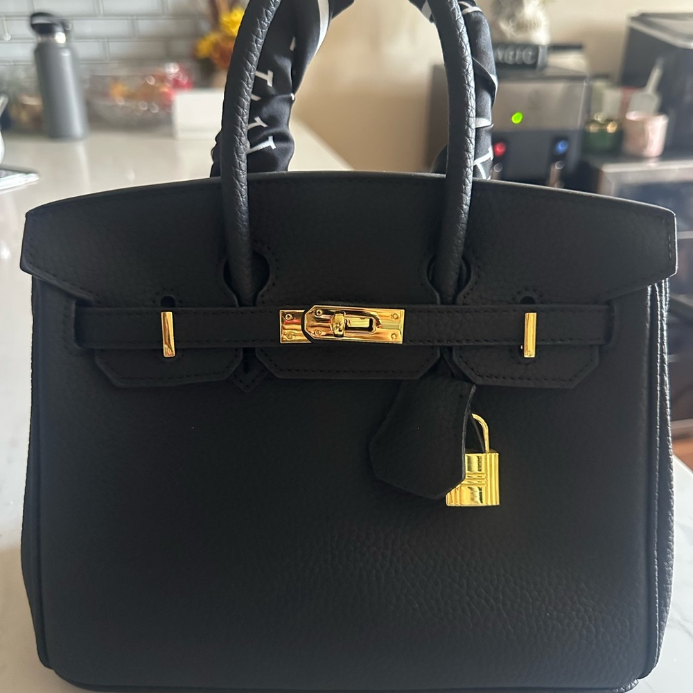 Elegant Black Handbag with Gold Accents